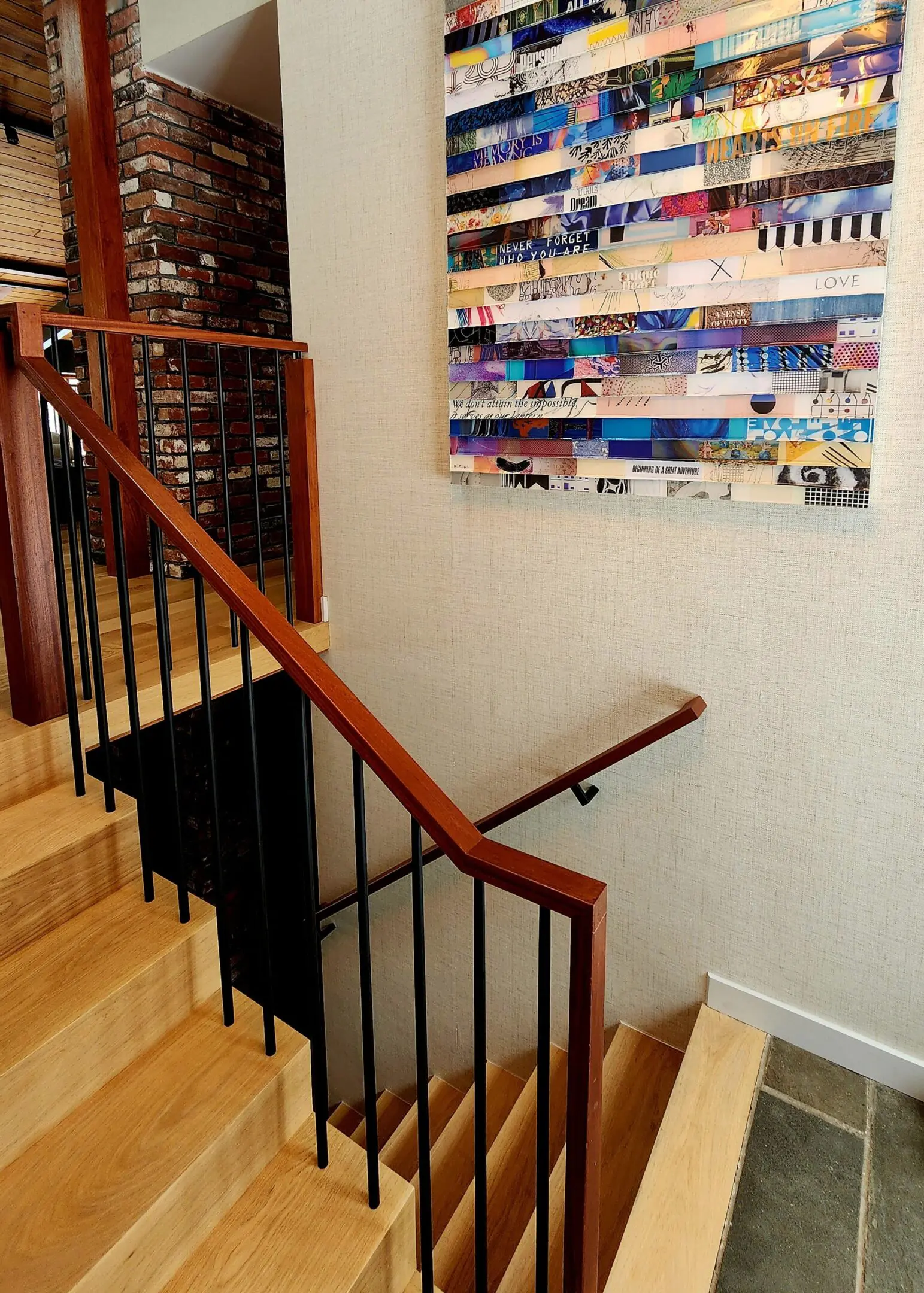 A staircase with wooden steps and metal railing.